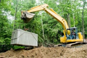 backhoe raising a septic system