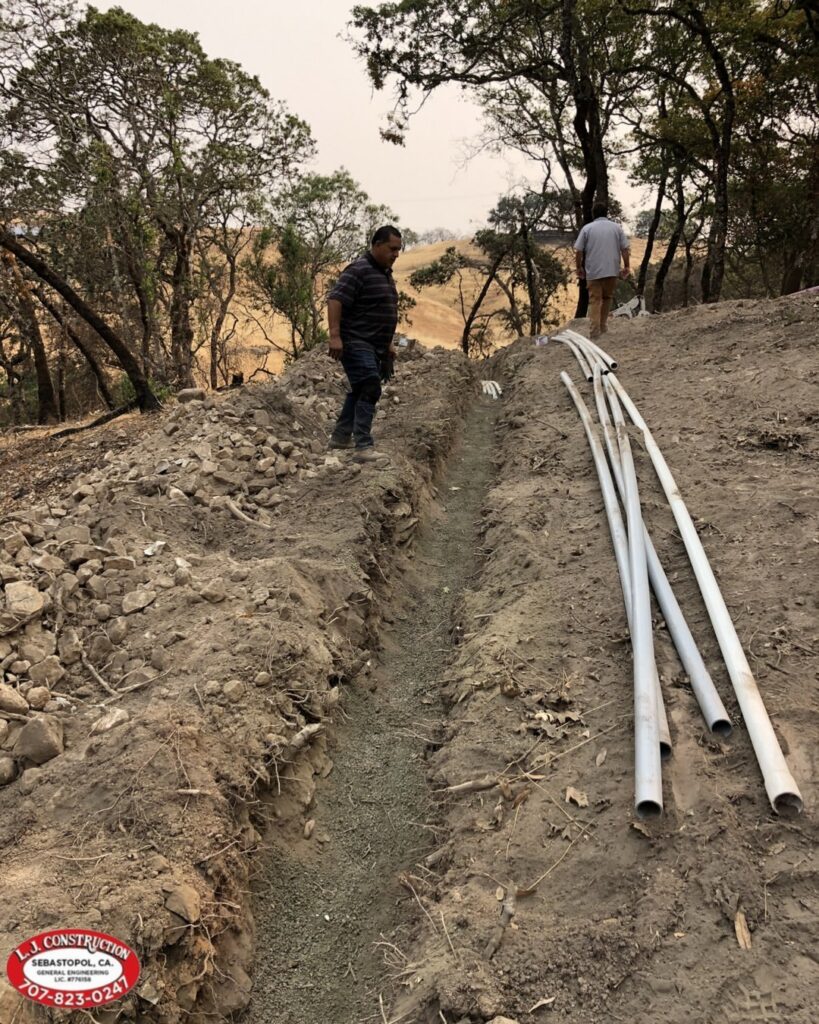 pipes along a dirt hole