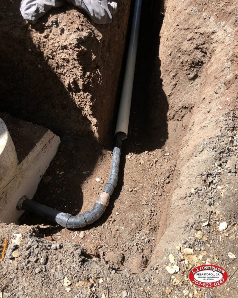 Pipe attached to a tube in a hole in the ground